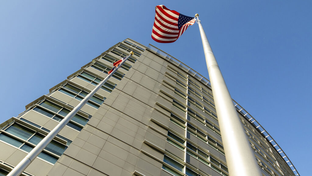 An American flag waves outside of Denver's Wellington Webb building downtown. Oct. 31, 2020.