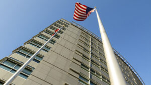 An American flag waves outside of Denver's Wellington Webb building downtown. Oct. 31, 2020.