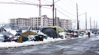A large encampment of people living without permanent housing on Arkins Court in Five Points, around the corner from the Crossroads shelter. Nov, 24, 2020.