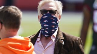 John Elway, president of football operations for the Denver Broncos, looks on before an NFL football game against the Tampa Bay Buccaneers, Sunday, Sept. 27, 2020, in Denver. (AP Photo/Jack Dempsey)