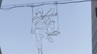The street wire artist Reed Bmore created a portrait of Elijah McClain, a Black man who was killed after being placed in a chokehold by Aurora police in 2019. The piece hangs near 18th Avenue and Sherman Street.