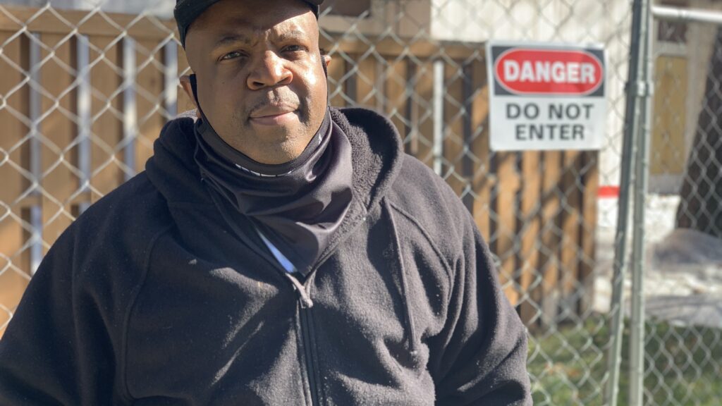 Chris Washington returned on Oct. 31, 2020 to the building where he lived before an August fire in a neighbor's apartment. Washington and other former residents were shocked to find they faced eviction proceedings after being displaced by the fire at Pine Creek Apartments.