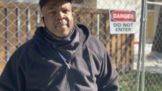 Chris Washington returned on Oct. 31, 2020 to the building where he lived before an August fire in a neighbor's apartment. Washington and other former residents were shocked to find they faced eviction proceedings after being displaced by the fire at Pine Creek Apartments.