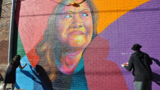 Thomas Evans' latest work at 24th and Curtis street in Five Points is a tribute to the work of activist Nga Vuong-Sandoval, a refugee who fled Vietnam with her family as a child — and who now advocates for the rights of other refugees and immigrants.