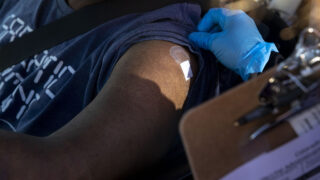 Don Richardson receives a COVID-19 vaccine at a pop-up clinic at Servicios De La Raza in Denver's West Colfax neighborhood. Jan. 30, 2021.