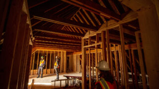 Jim Hartman (left to right), Grant D. Bennett and Susan Ely tour Loretto Heights' historic Pancratia Hall as its old dorms are transformed into affordable housing units. Harvey Park South, Feb. 10, 2021.