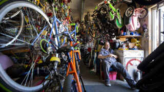 Thomas Padilla sits inside of his One Stop Bike Shop on Morrison Road. Feb. 23, 2021.