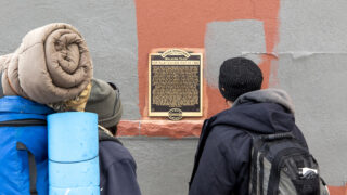 A historic marker in LoDo that details the "Chinese Riot of 1880." Feb. 25, 2021.