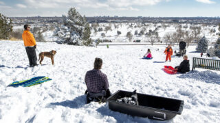 Kids sled the big hill at Ruby Hill in Denver. Feb. 25, 2021.