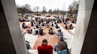 East High School students sit for five minutes of silence during a walk-out in solidarity with Boulder on Thursday afternoon. March 25, 2021.