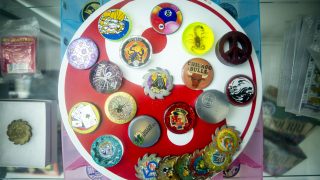 Rare slammers in a display case at the Denver Pog store, now installed at Understudy Denver, the experimental arts space beneath the Convention Center steps. March 30, 2021.