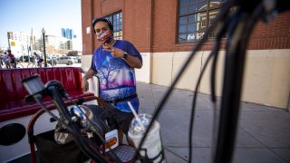 Ric Campos hustles his pedicab business in LoDo during Opening Day at Coors Field. April 1, 2021.