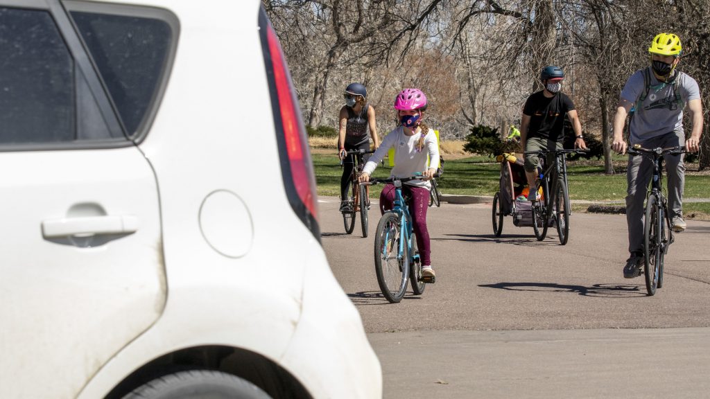 Advocates for car-free streets in City Park go on a big bike ride through the green space to push their point. April 10, 2021.