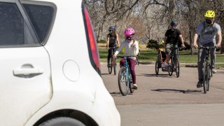Advocates for car-free streets in City Park go on a big bike ride through the green space to push their point. April 10, 2021.