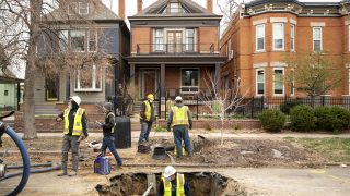 Denver Water workers replace lead pipes leading into a home in Whittier. April 15, 2021.