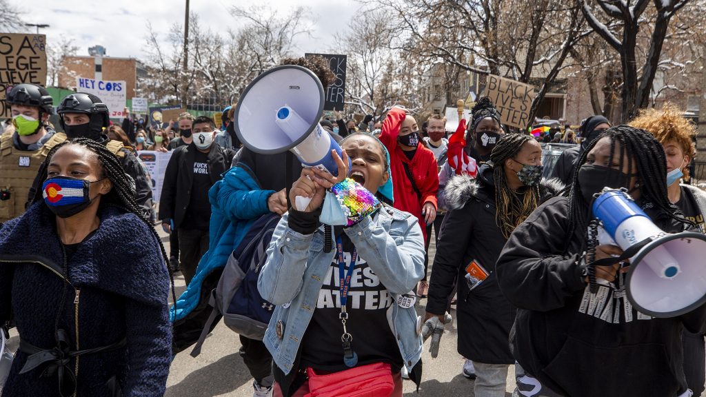 Ashira Campbell leads a protest against police brutality through North Capitol Hill. April 17, 2021.