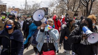 Ashira Campbell leads a protest against police brutality through North Capitol Hill. April 17, 2021.