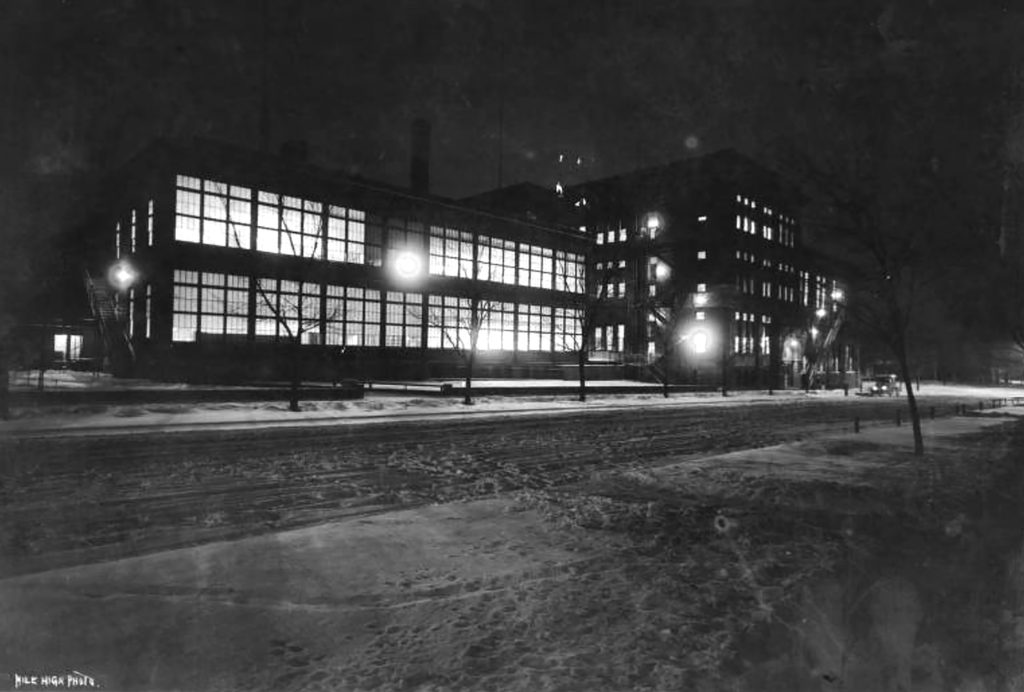 The Old Manual High School during winter's night in Denver, Colorado. Circa 1910.