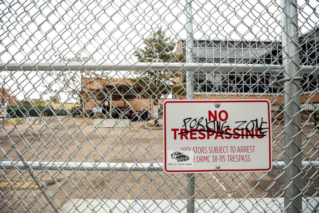 Graffiti on a sign at Denver Police's District 6 headquarters at Washington Street and Colfax Avenue. May 27, 2021.