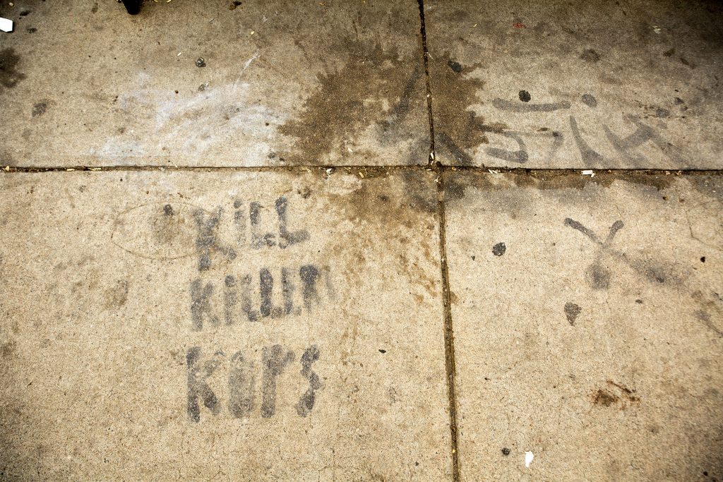 "KILL KILLER COPS" spraypainted on the side of Colfax Avenue by the Colorado State Capitol. May 27, 2021.