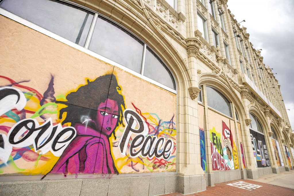 Murals on plywood covering the "sports castle" on Broadway. May 27, 2021.