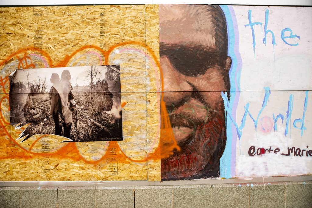 Murals on plywood covering the "sports castle" on Broadway. May 27, 2021.