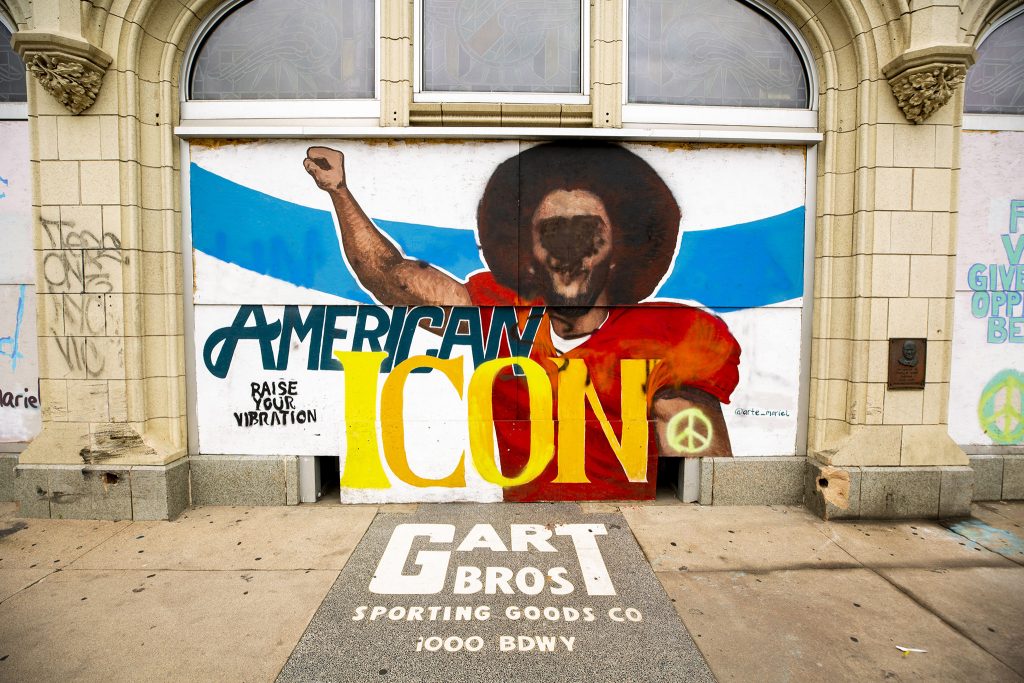 A mural on plywood covering the "sports castle" on Broadway. May 27, 2021.
