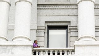 Rep. Leslie Herod stands outside the State House of Representatives chamber at the Capitol. May 27, 2021.