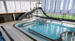 A rendering of the indoor pool coming to Green Valley Ranch Recreation Center. The color of the slides and other amenities has not been solidified.