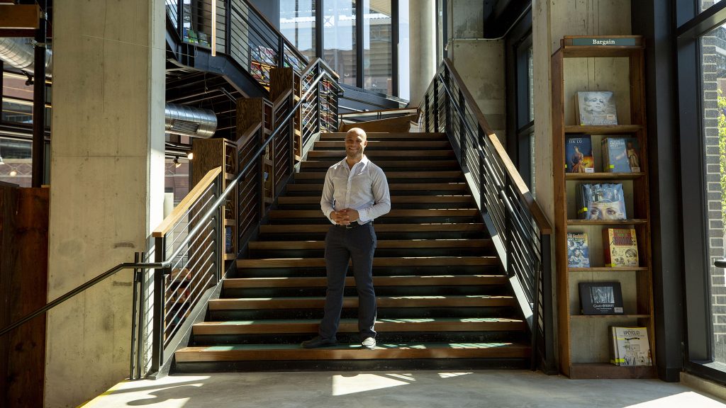 Tattered Cover CEO Kwame Spearman stands in the bookstore's new location at McGregor Square. June 8, 2021.
