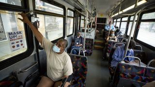 Jacqueline Lawrence pulls the stop cords as RTD's number 15 bus heads east. June 16, 2021.