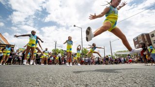 The Queens & Kings of Dynasty Dance group performs in the heart of Five Points during Denver's Juneteenth Parade. June 19, 2021.
