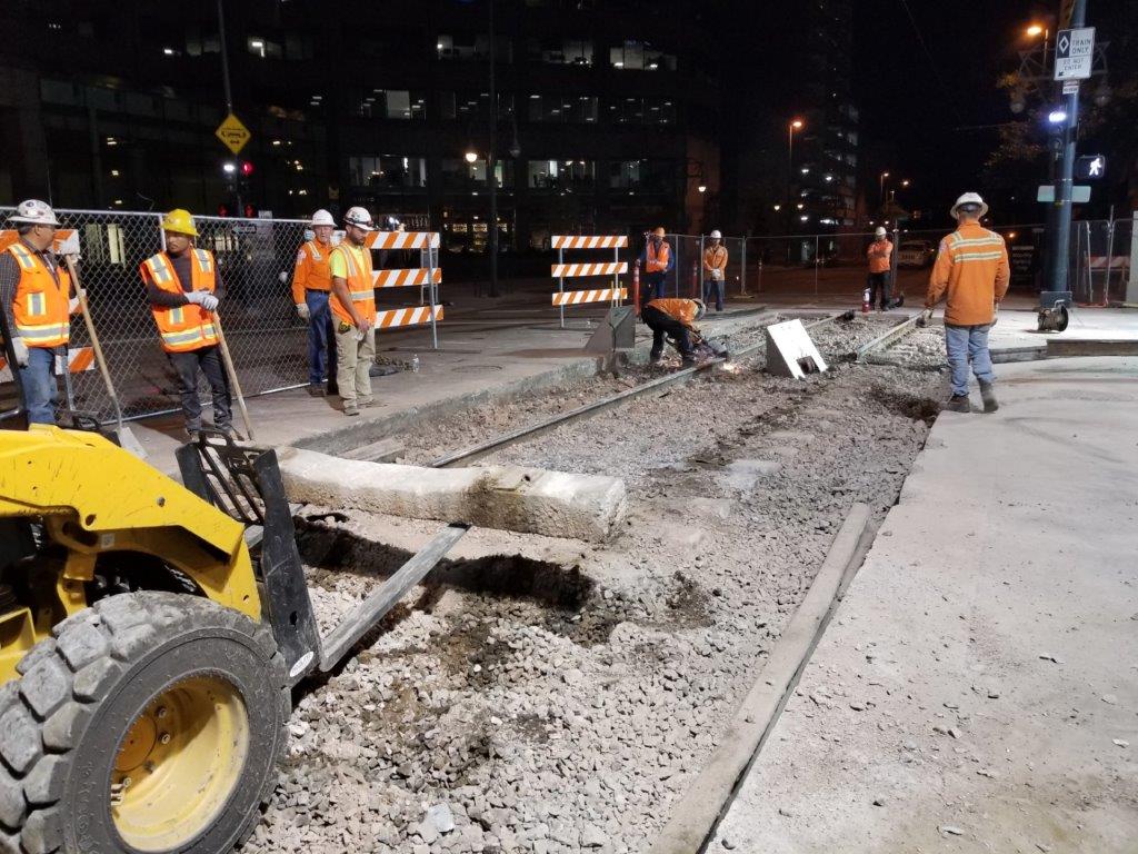 Construction crews pull up a section of light rail track on 18th and California in 2018. (Courtesy of RTD)