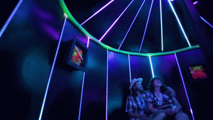 Gita Cornell and Ryan Phillips marvel at a glowing room in Novo Ita, the new immersive show at Spectra Art Space. June 30, 2021.