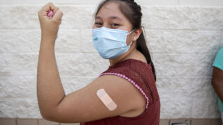 Kehara Chale just got a COVID-19 vaccine at a mobile clinic in Aurora. July 23, 2021.