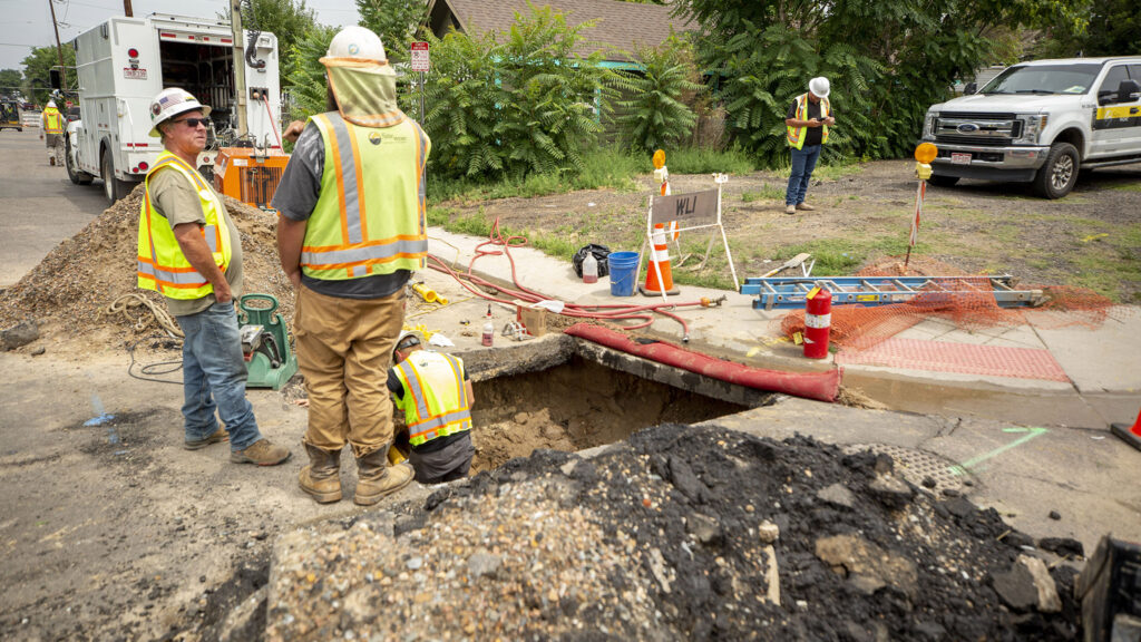 Xcel Energy crews are working overtime to replace tons of gas lines in Elyria Swansea. July 31, 2021.