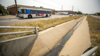 An RTD bus lumbers east down 47th Avenue in Montbello. Aug. 10, 2021.