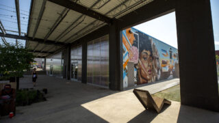 A mural by Robin Munroe adorns the side of the future Denver Public Library Branch at the ArtPark Community Hub off Brighton Boulevard in RiNo. Five Points, Aug. 19, 2021.