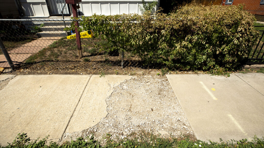 A troubled sidewalk in Globeville. Aug. 24, 2021.