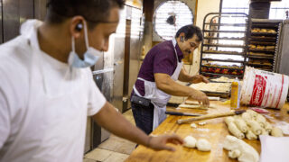 Manuel Contreras (right) spins dough at his panaderia on Morrison Road. Sept. 10, 2021.
