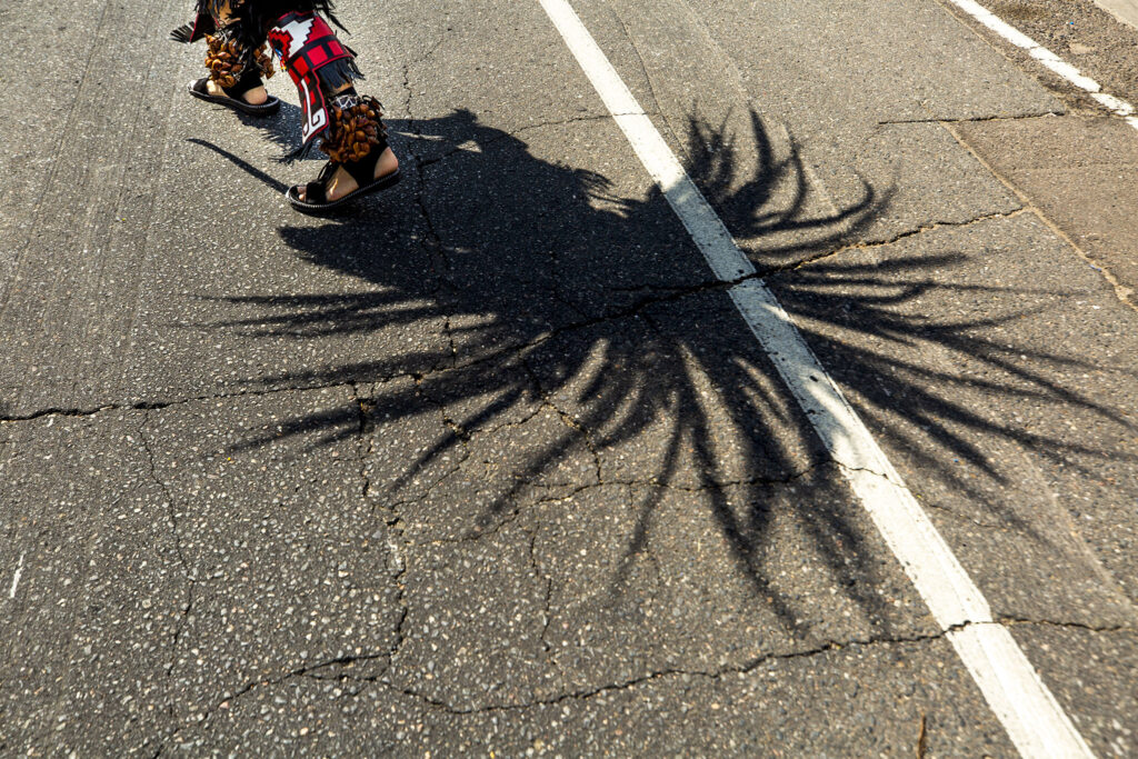 Santiago Jaramillo, a member of Kalpulli Tepeyollotl, performs an indigenous Aztec dance on Morrison Road during the Westwood Chile Fest. Sept. 11, 2021.