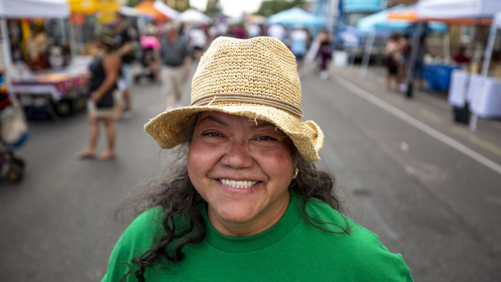 Irma Díaz, of the Mujeres Emprendedoras Cooperative, stands on Morrison Road during the Westwood Chile Fest. Sept. 11, 2021.
