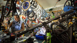 Thomas Padilla at work inside One Stop Bike Shop on Morrison Road. Westwood, Sept. 21, 2021.