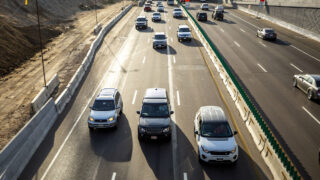SUVs sit in I-70 traffic through north Denver. Sept. 24, 2021.