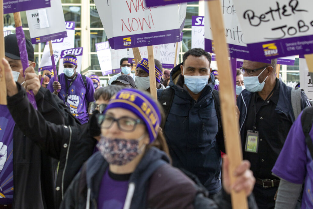 Members of the Service Workers International Union picket for higher wages at Denver International Airport. Oct. 1, 2021.