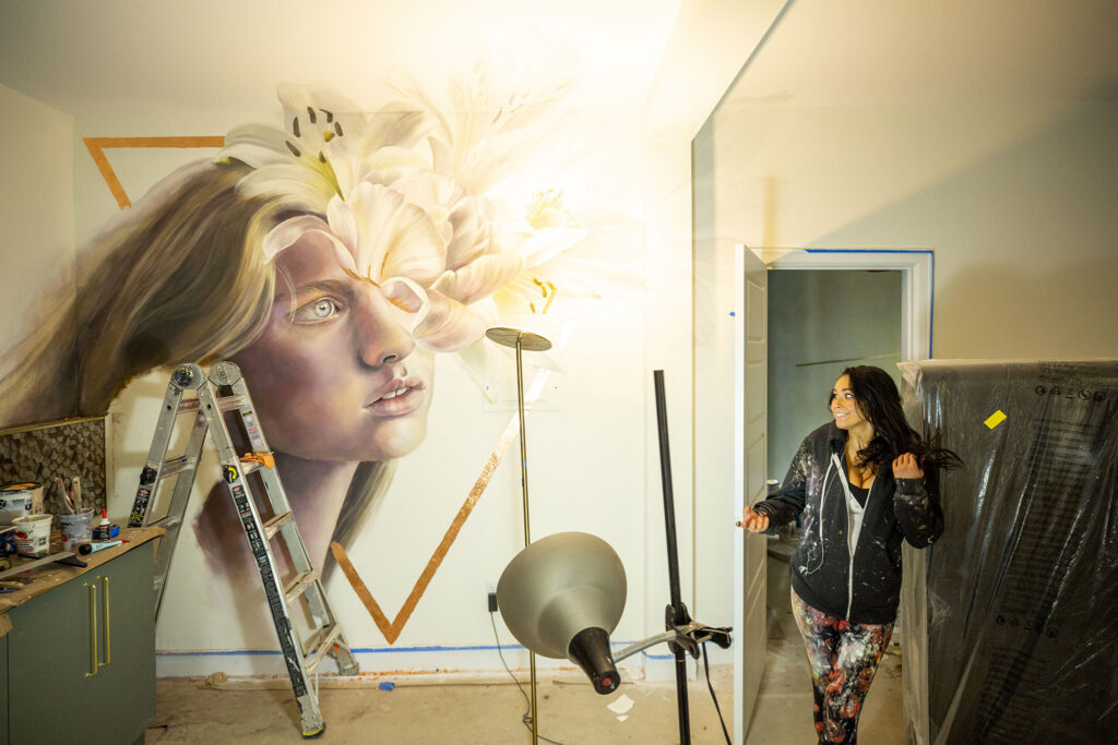 Marissa Nepoletano stands in the room she is painting in the future Acoma House hotel.  October 21, 2021.