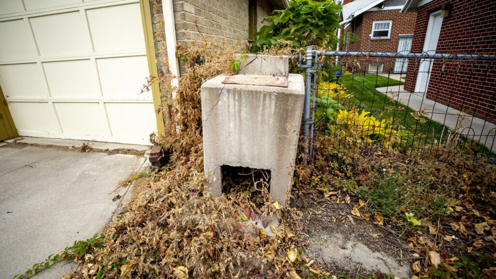 An old concrete incinerator in a Washinton Park West alleyway. Oct. 23, 2021.