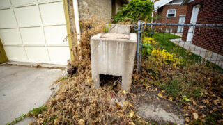 An old concrete incinerator in a Washinton Park West alleyway. Oct. 23, 2021.