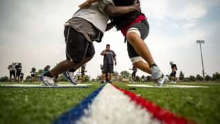 Coach Tony Lindsay Sr. blows a whistle during a linemen drill. Aug. 10, 2021.