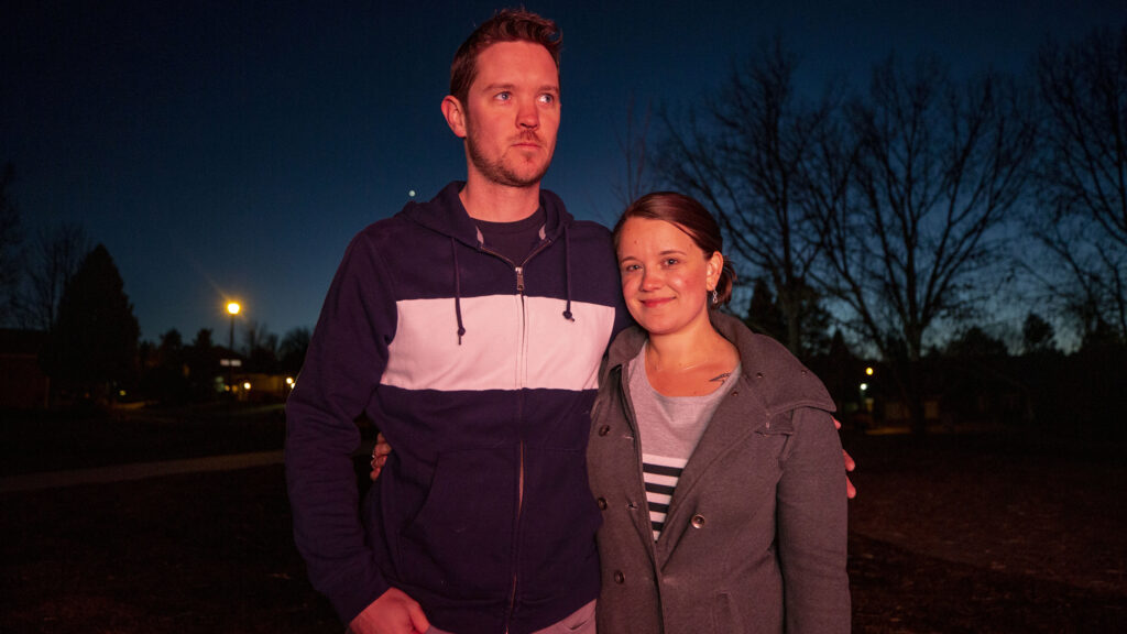 Kristin and Brett Post stand in a park near the home they're sharing with family in Lone Tree. Nov. 17, 2021.